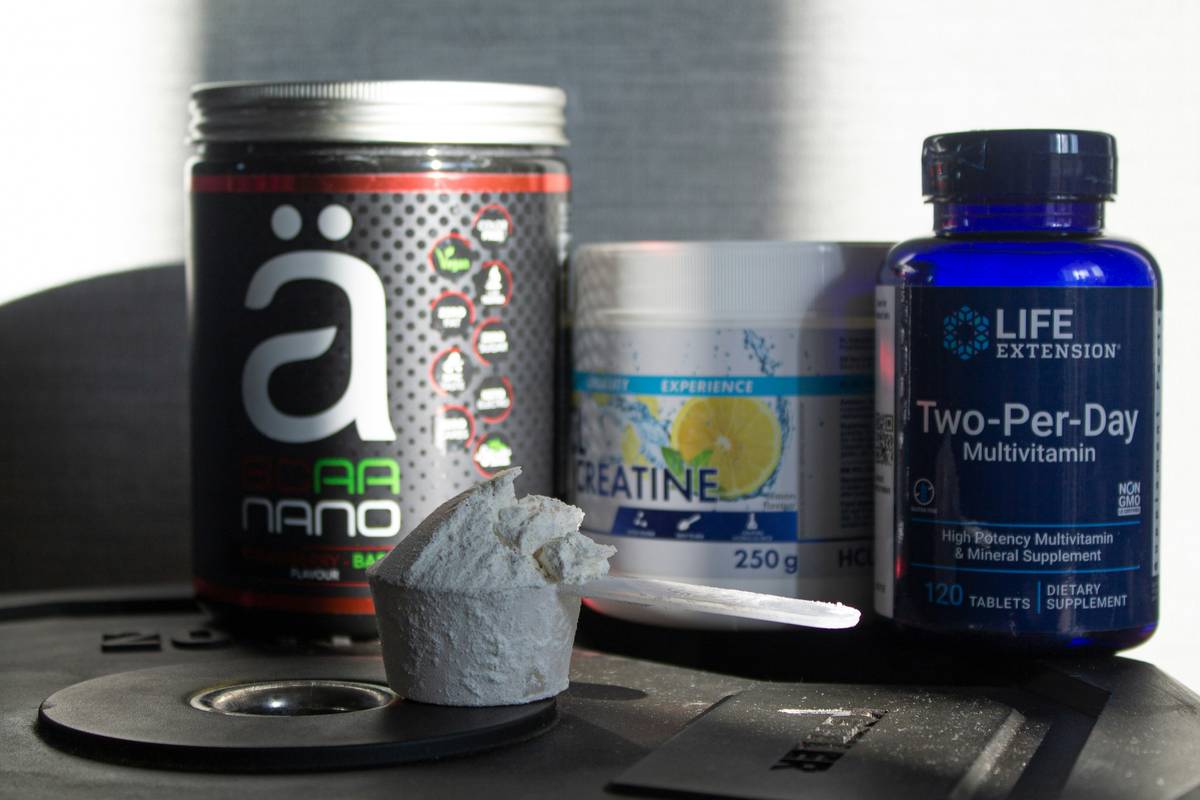 man reviewing men s testosterone booster supplement label for safety and ingredients